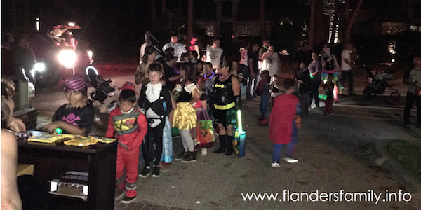 Passing out candy and tracts to trick-or-treaters